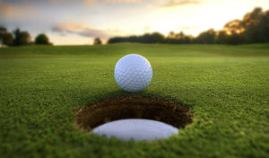 Golf Ball near hole Michelle Brutlag Hosick for Junior Golf Magazine